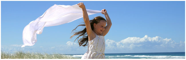 Mac Web Hosting - Small girl running free on the beach.